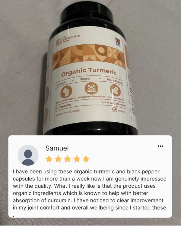 Bottle of organic turmeric capsules with a 5-star rating review on a gray background